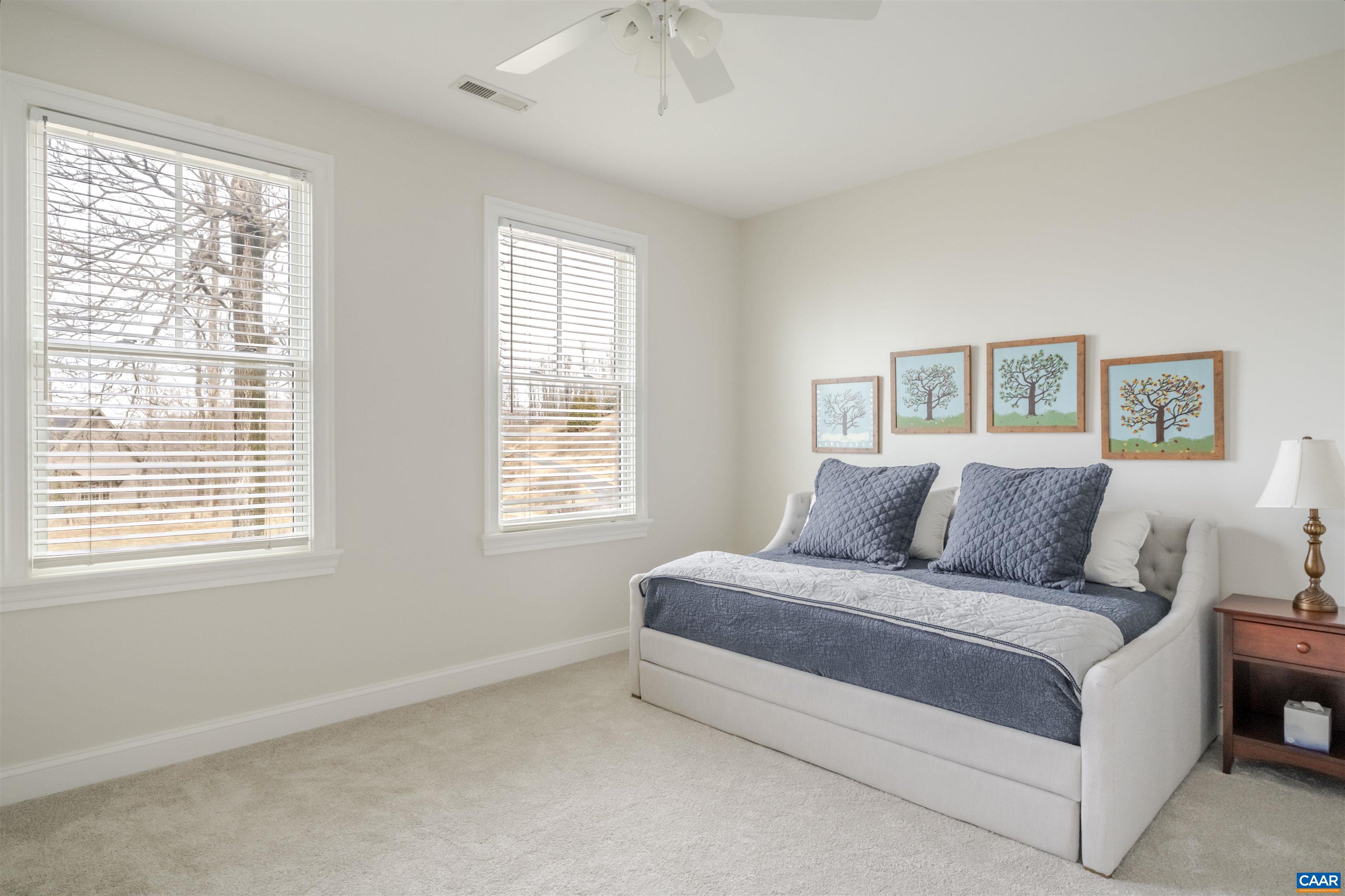 765 Summit Ridge Point Charlottesville, VA 22911 - Photo 35 of 60 a spacious bedroom with a bed and a window