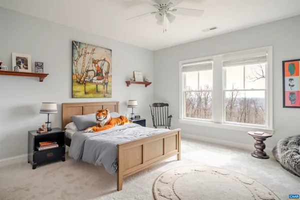 a living room with furniture rug and lamp