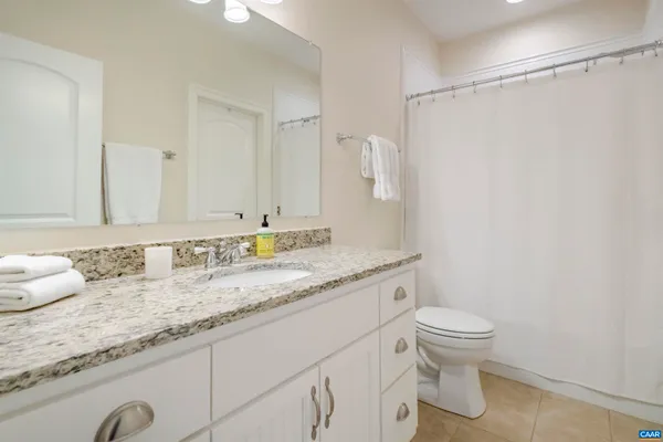 a bedroom with furniture and window