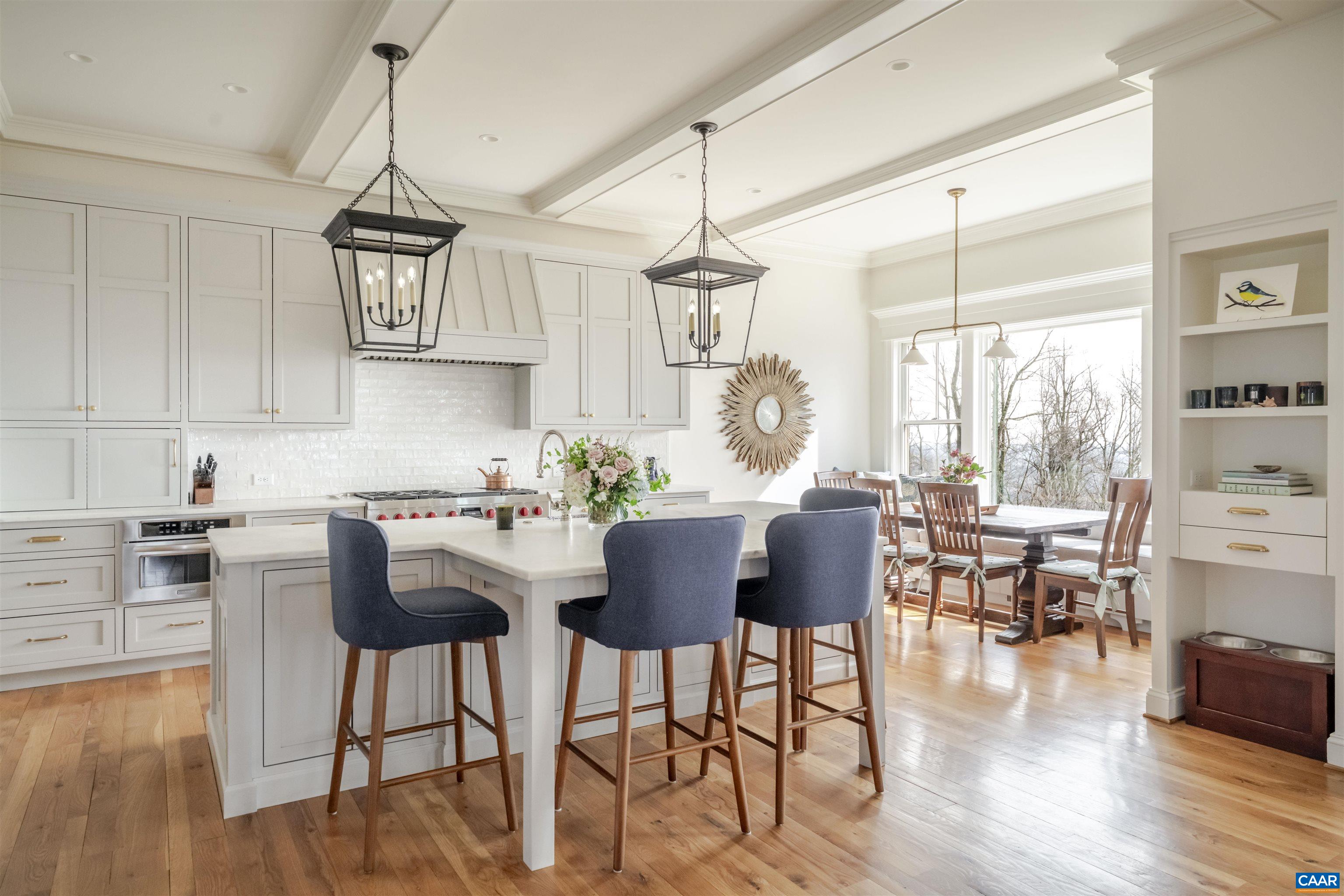 765 Summit Ridge Point Charlottesville, VA 22911 - Photo 4 of 60 a view of kitchen with dining table chairs and wooden floor