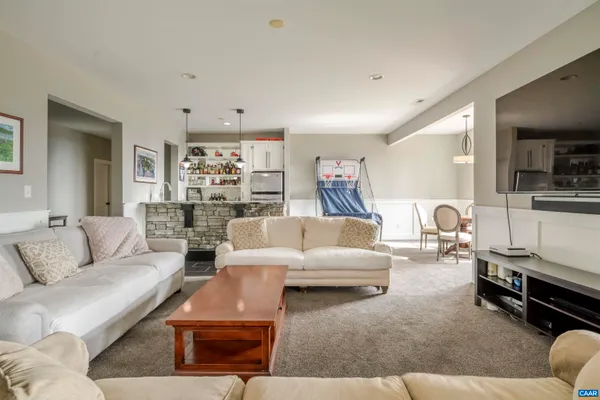 a bathroom with a double vanity sink toilet and a mirror