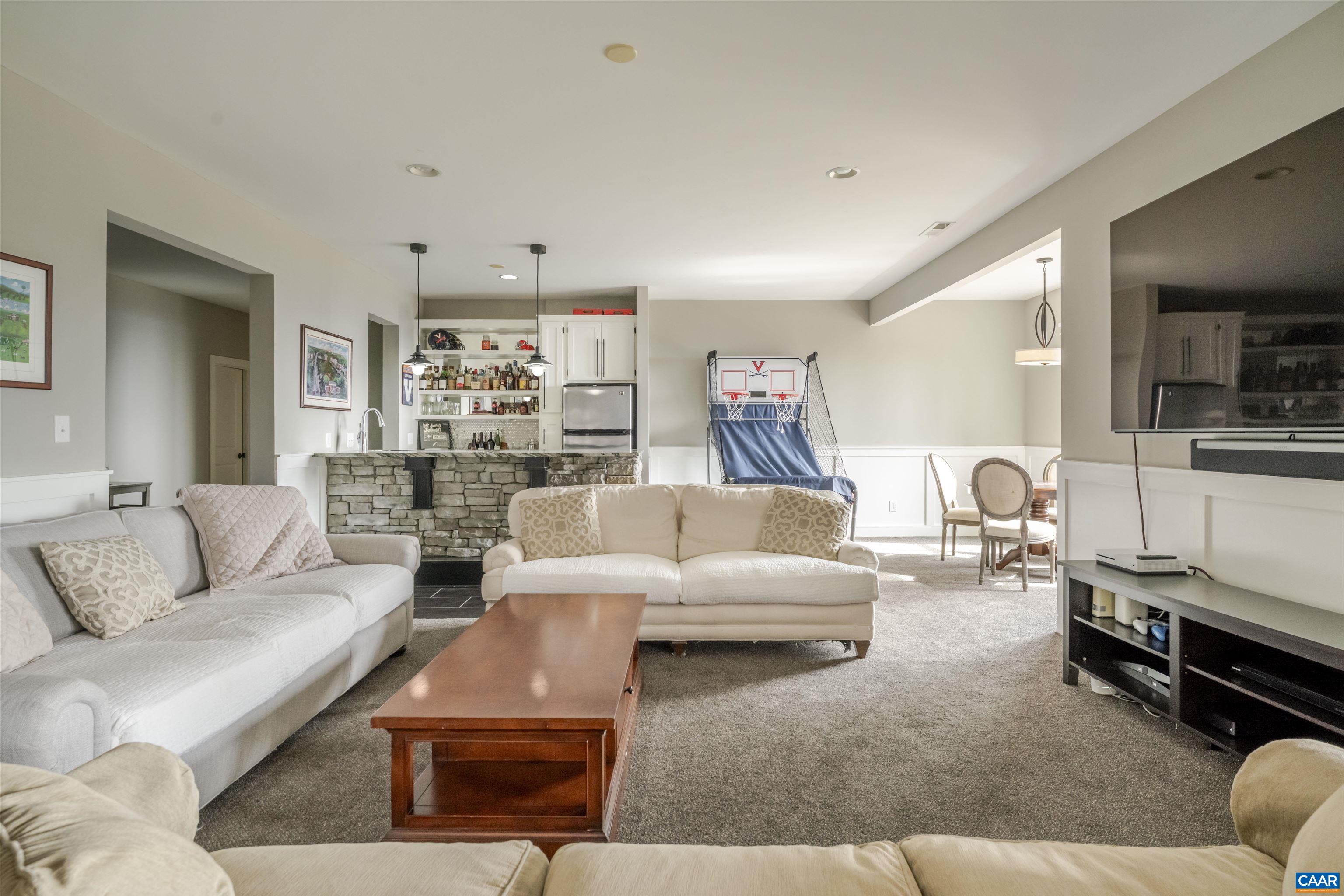 765 Summit Ridge Point Charlottesville, VA 22911 - Photo 42 of 60 a living room with furniture rug and lamp
