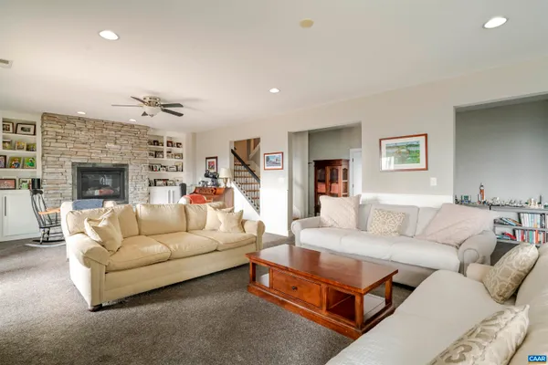 a workspace with furniture and chandelier