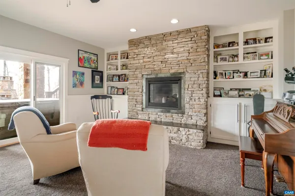 a view of balcony with chairs and wooden fence