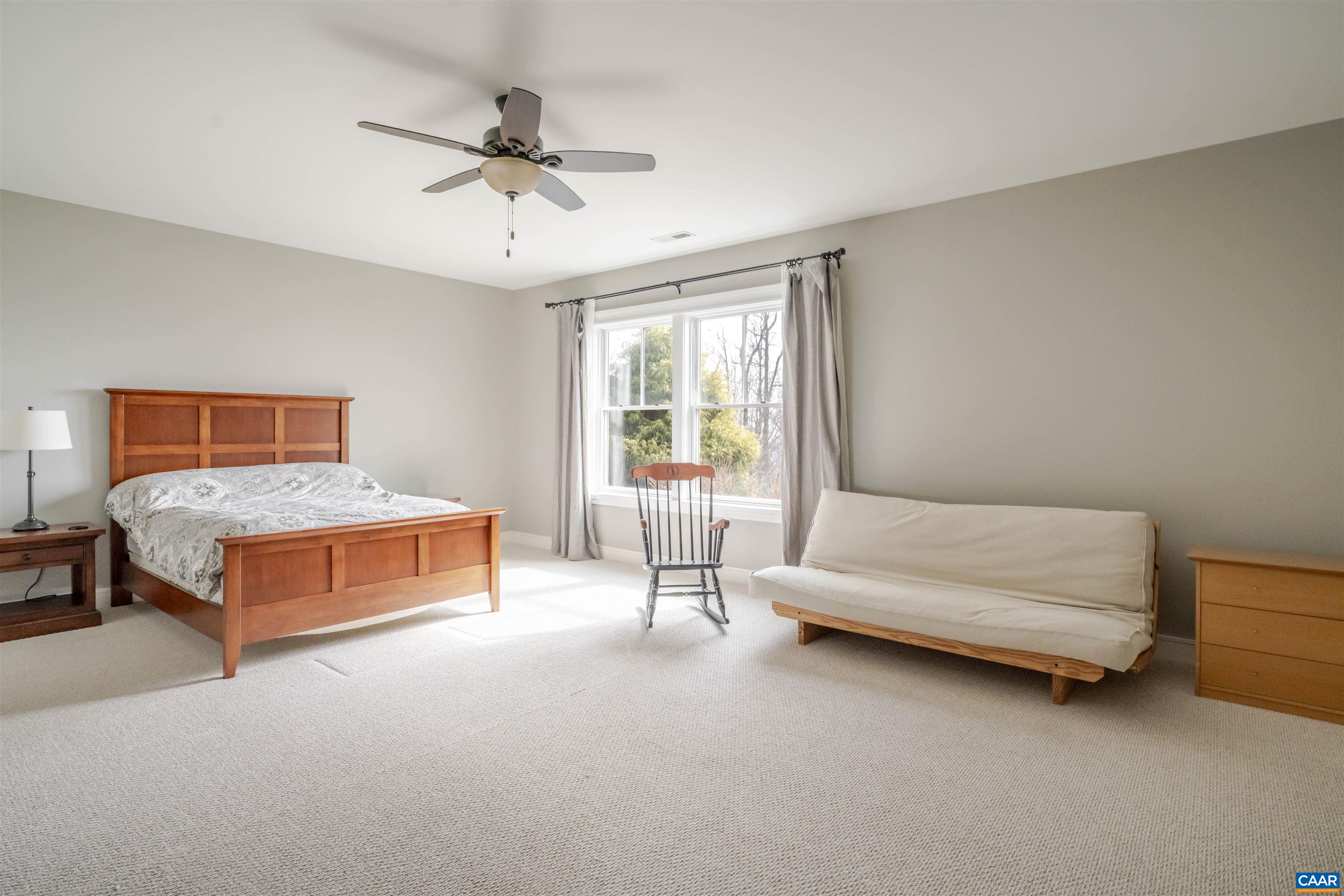 765 Summit Ridge Point Charlottesville, VA 22911 - Photo 46 of 60 a bedroom with furniture and window