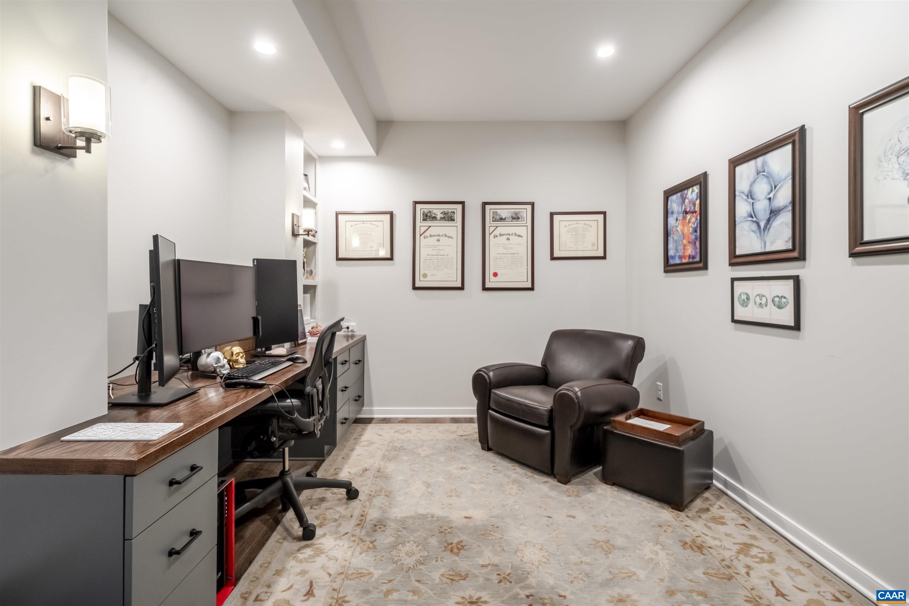 765 Summit Ridge Point Charlottesville, VA 22911 - Photo 49 of 60 a livingroom with workspace and a couch