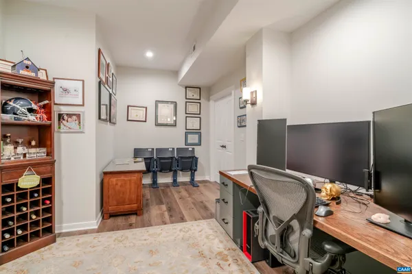 a view of a big house with a big yard and large tree