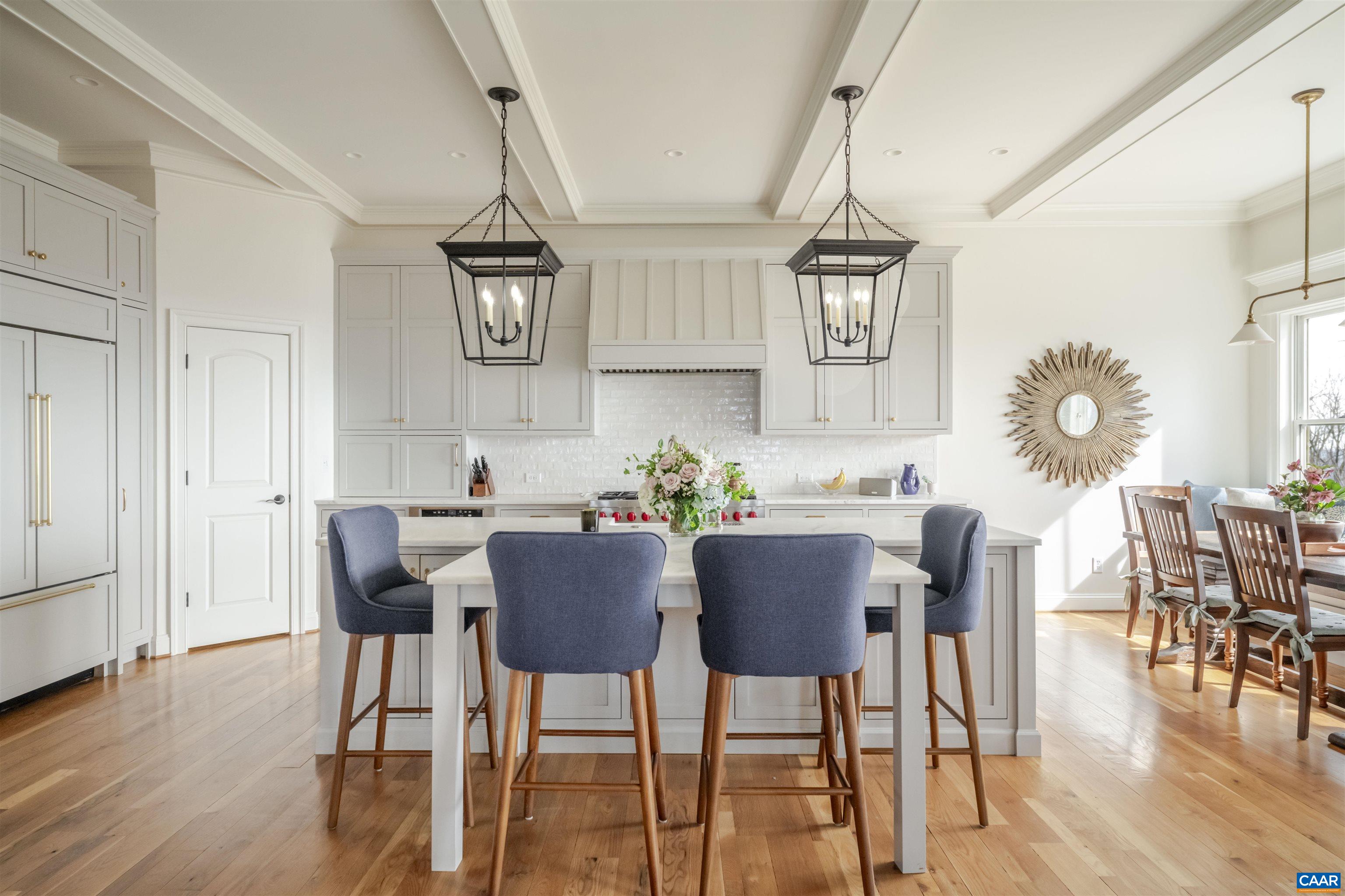 765 Summit Ridge Point Charlottesville, VA 22911 - Photo 5 of 60 a view of a dining room with furniture wooden floor and chandelier