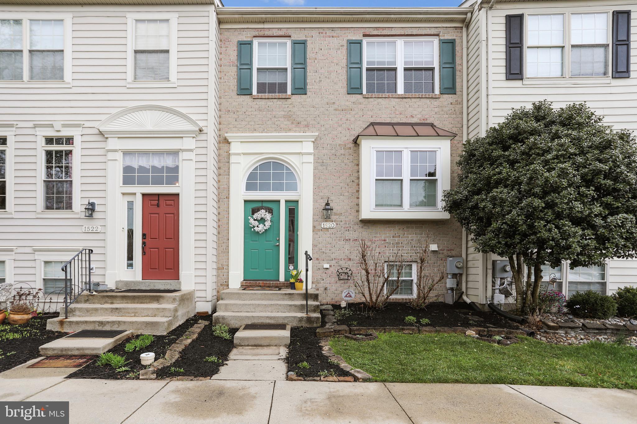 1520 Laurel Wood Way Frederick, MD 21701 - Photo 1 of 30 a front view of a house with a yard