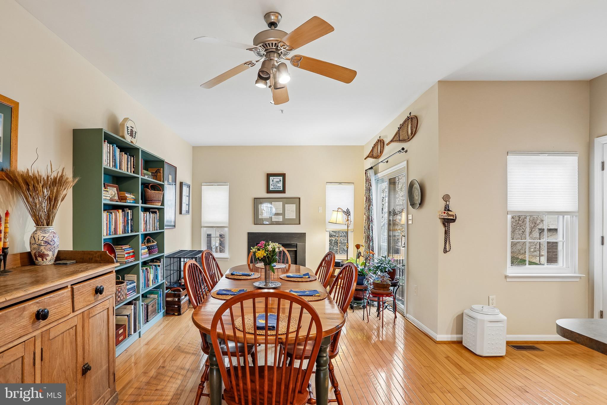 1520 Laurel Wood Way Frederick, MD 21701 - Photo 13 of 30 a view of a dining room with furniture and wooden floor
