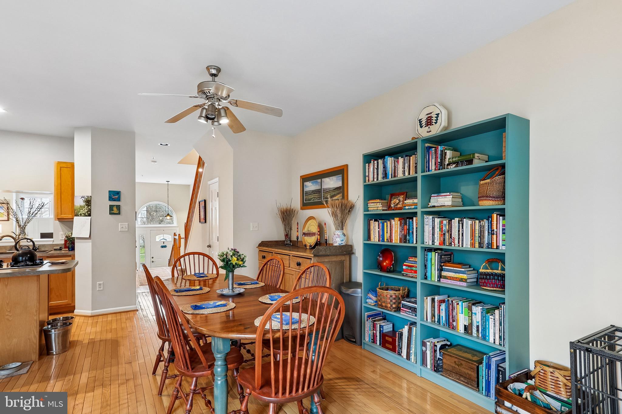 1520 Laurel Wood Way Frederick, MD 21701 - Photo 15 of 30 a view of a dining room with furniture and a book shelf