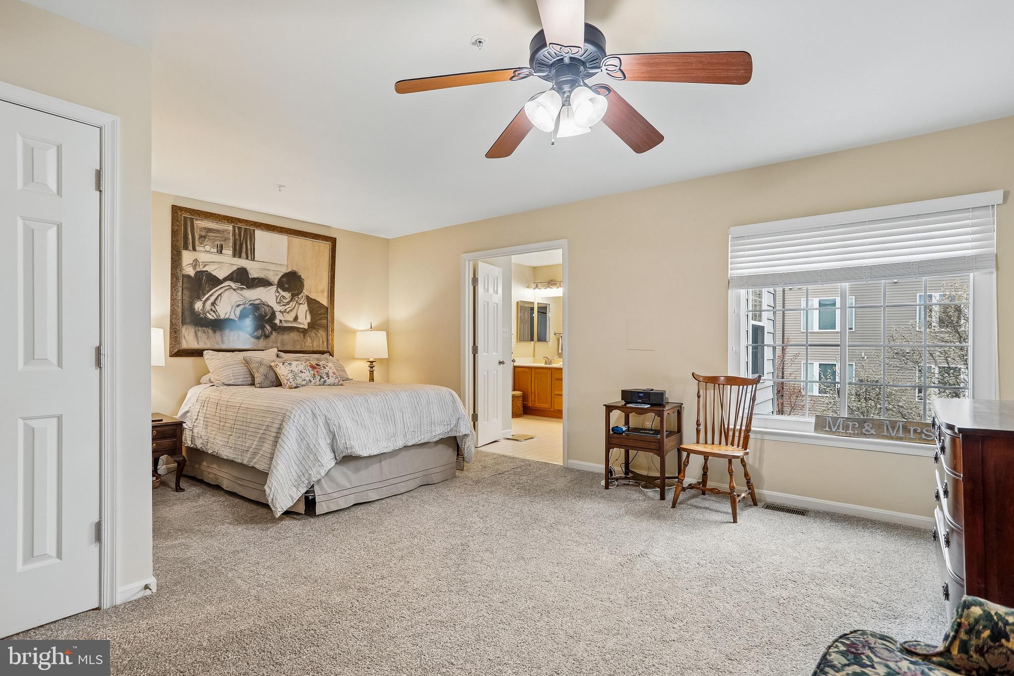 1520 Laurel Wood Way Frederick, MD 21701 - Photo 17 of 30 a spacious bedroom with a bed and a large window