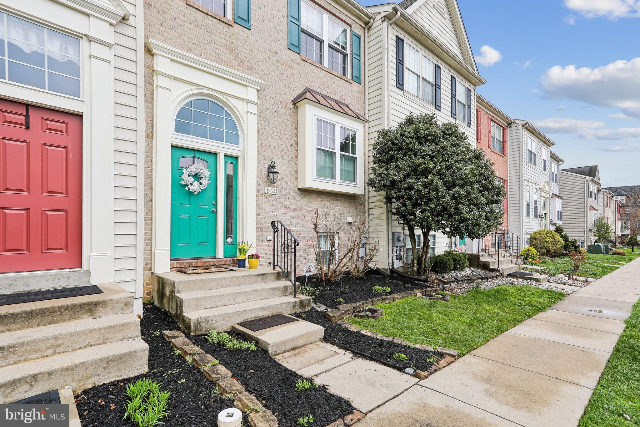 1520 Laurel Wood Way Frederick, MD 21701 - Photo 2 of 30 a front view of a house with garden