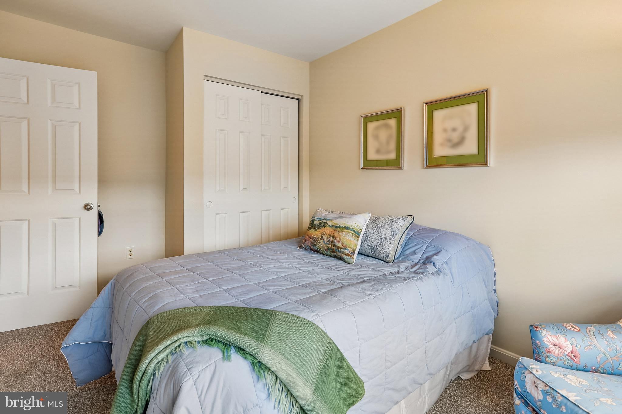 1520 Laurel Wood Way Frederick, MD 21701 - Photo 24 of 30 a bedroom with a bed and a painting on the wall