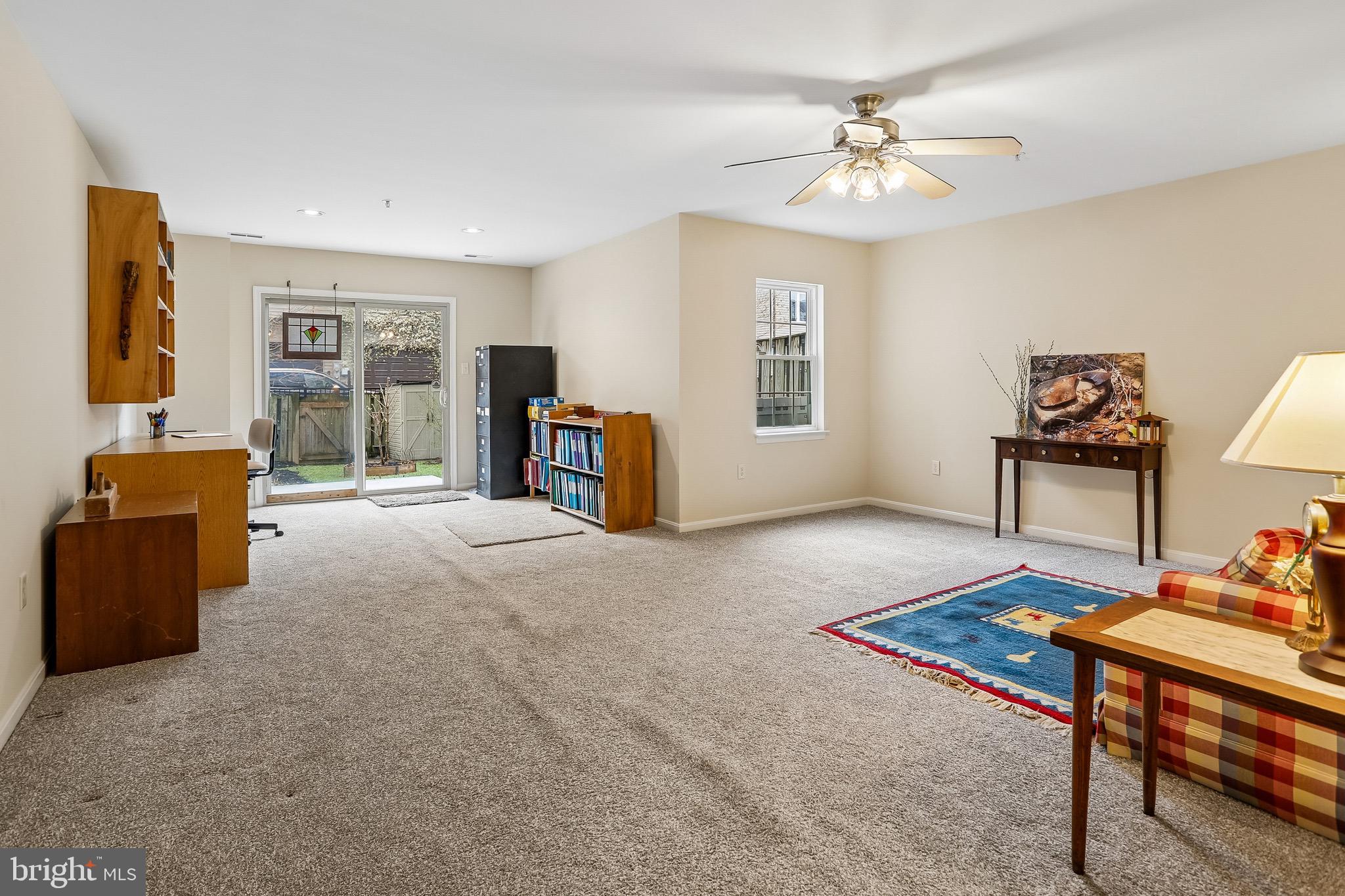 1520 Laurel Wood Way Frederick, MD 21701 - Photo 27 of 30 a living room with furniture and a table