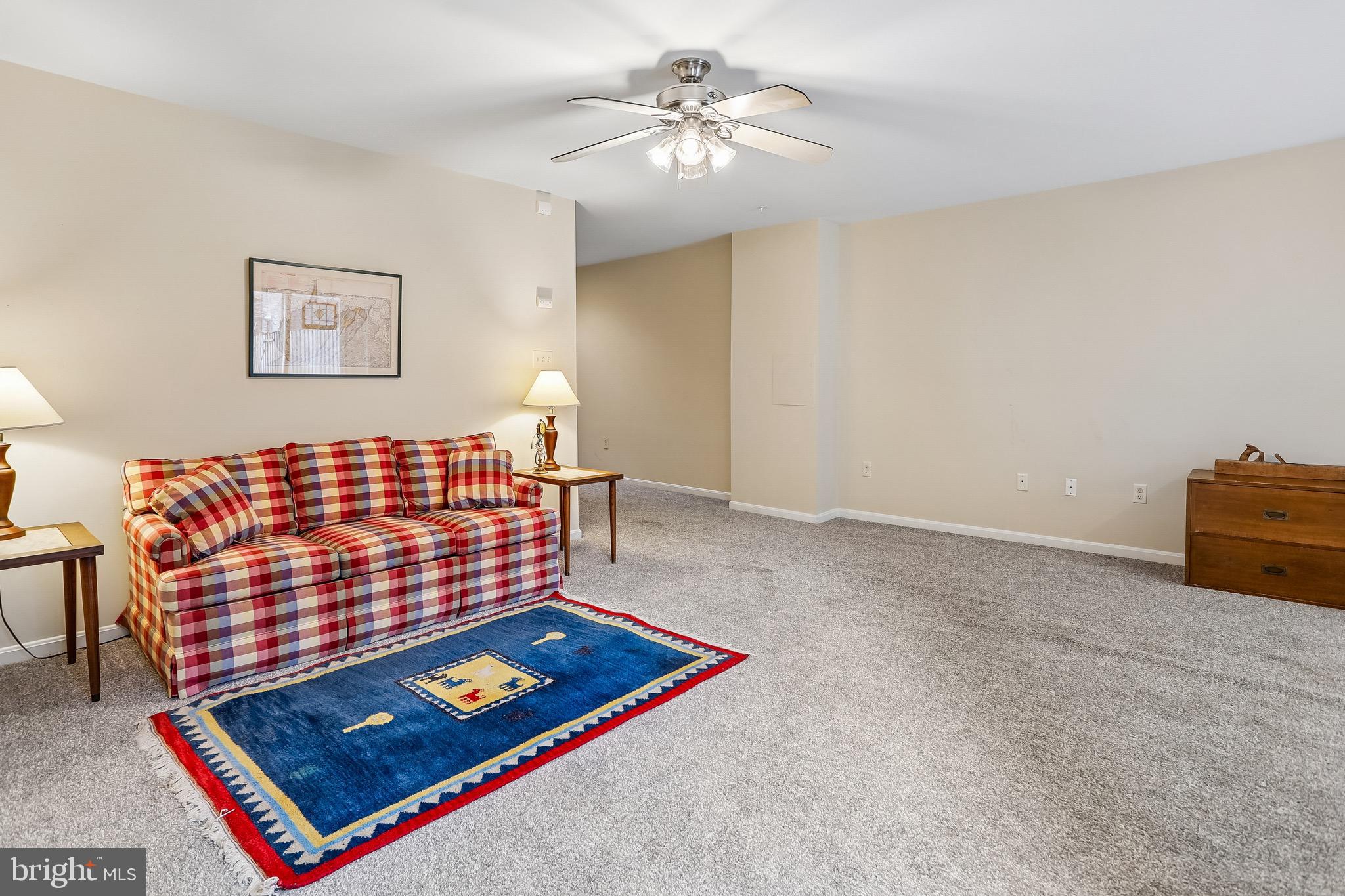1520 Laurel Wood Way Frederick, MD 21701 - Photo 29 of 30 a room with furniture and a chandelier