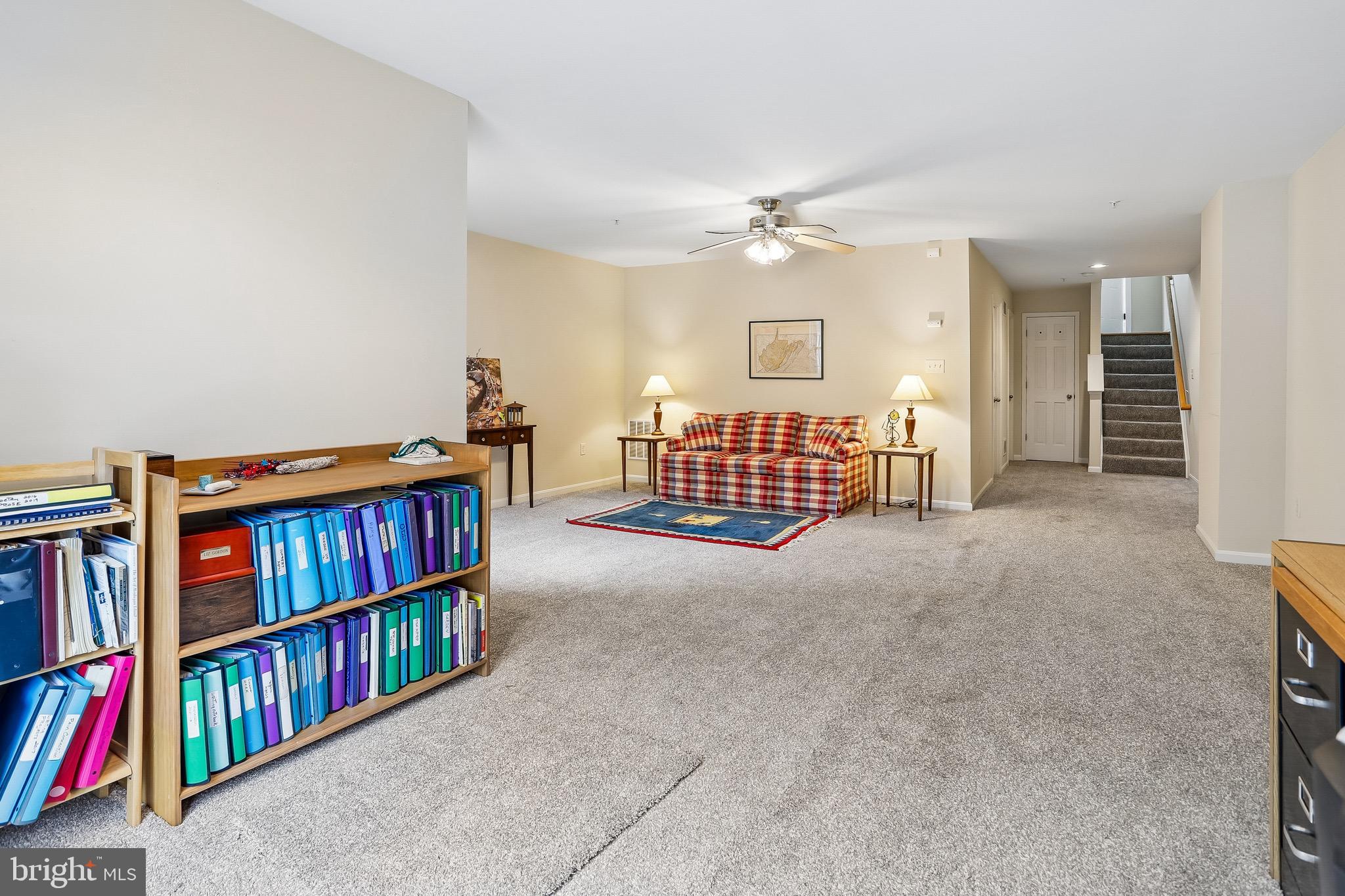 1520 Laurel Wood Way Frederick, MD 21701 - Photo 30 of 30 a living room with lots of furniture and a book shelf