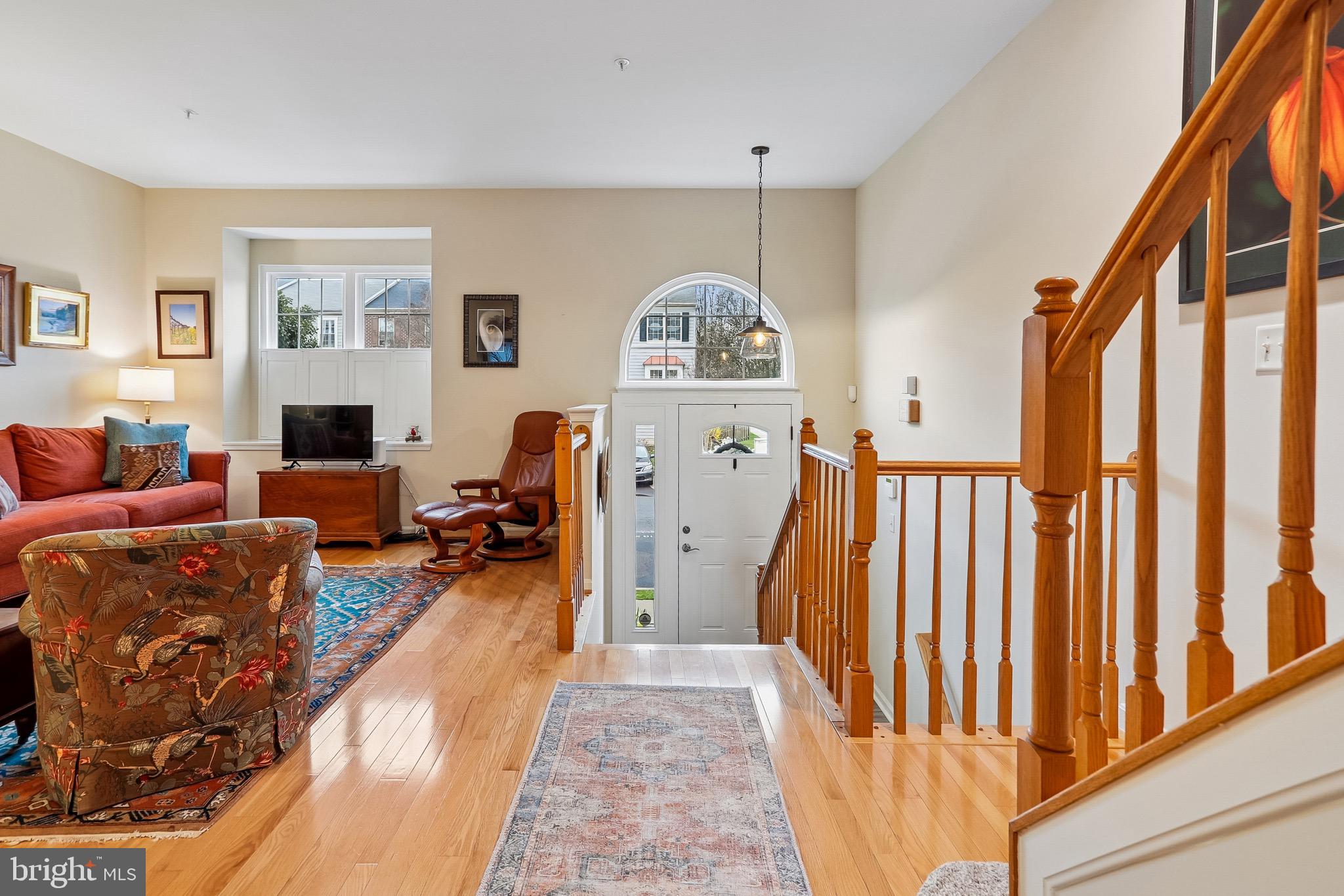 1520 Laurel Wood Way Frederick, MD 21701 - Photo 5 of 30 a living room with furniture a fireplace and a flat screen tv
