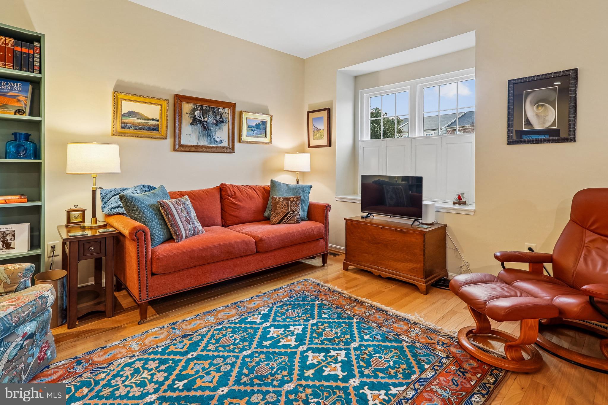 1520 Laurel Wood Way Frederick, MD 21701 - Photo 7 of 30 a living room with furniture and a rug