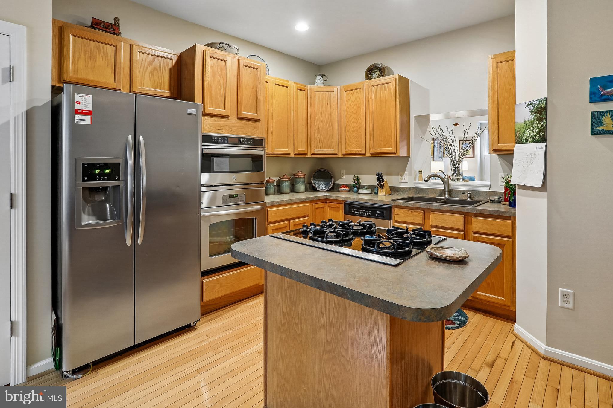 1520 Laurel Wood Way Frederick, MD 21701 - Photo 9 of 30 a kitchen with a stove and a refrigerator