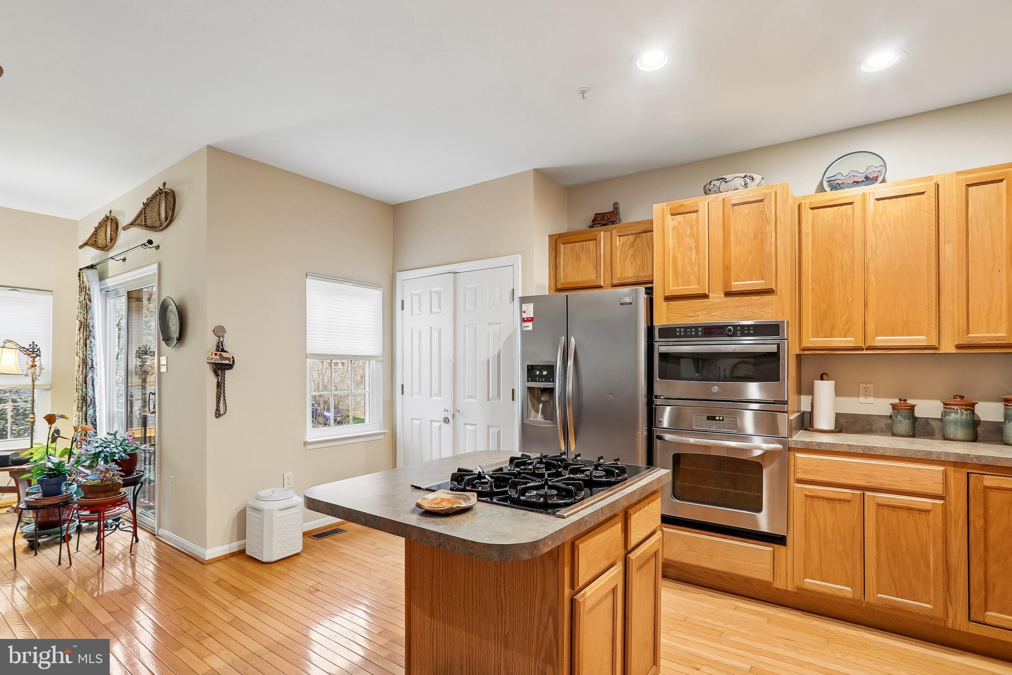 1520 Laurel Wood Way Frederick, MD 21701 - Photo 10 of 30 a kitchen with stainless steel appliances a stove a sink and a refrigerator