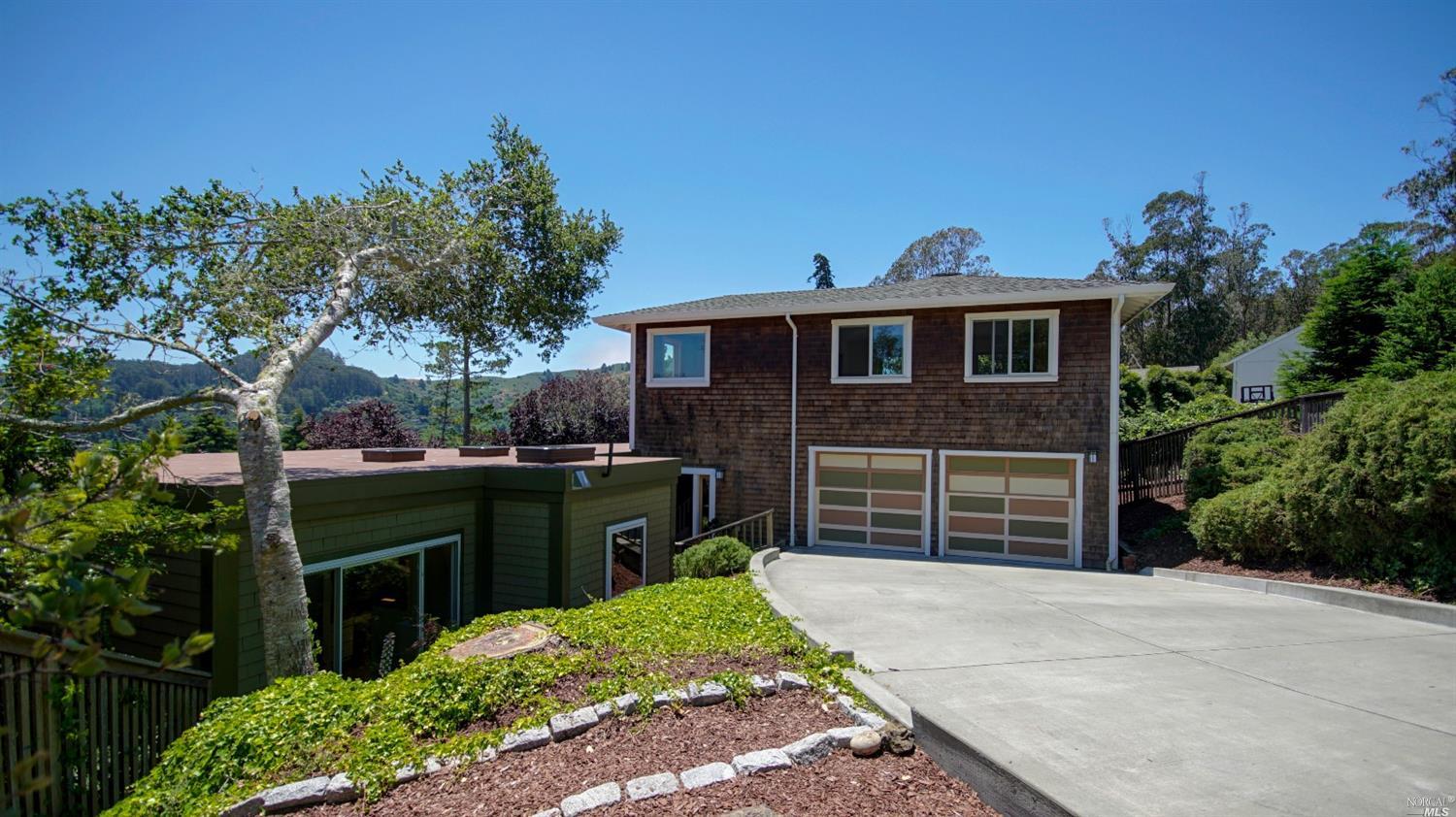 1012 Erica Road Mill Valley, CA 94941 - Photo 1 of 1 a front view of a house with a garden