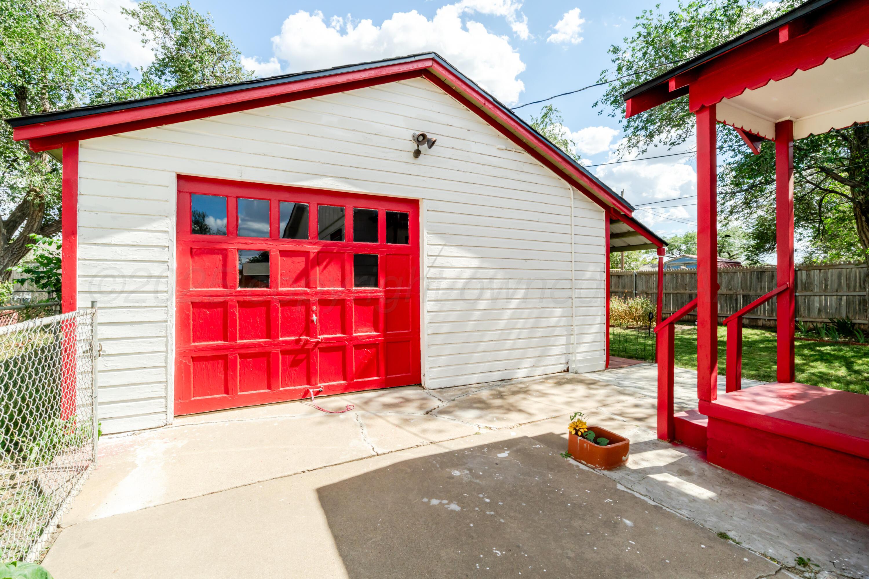4205 South Jackson Street Amarillo, TX 79110 - Photo 15 of 22 a front view of a house with a garage