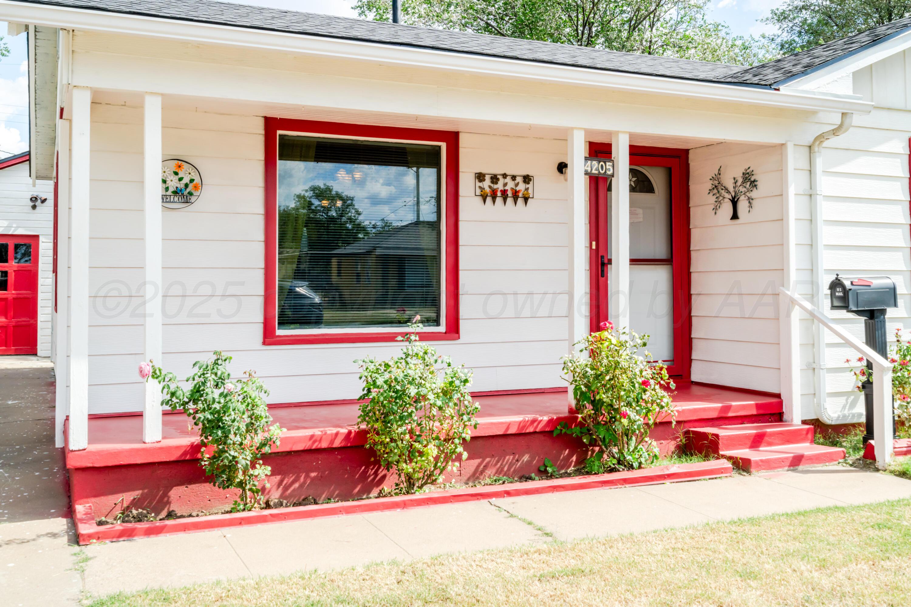 4205 South Jackson Street Amarillo, TX 79110 - Photo 4 of 22 a front view of a house with a yard