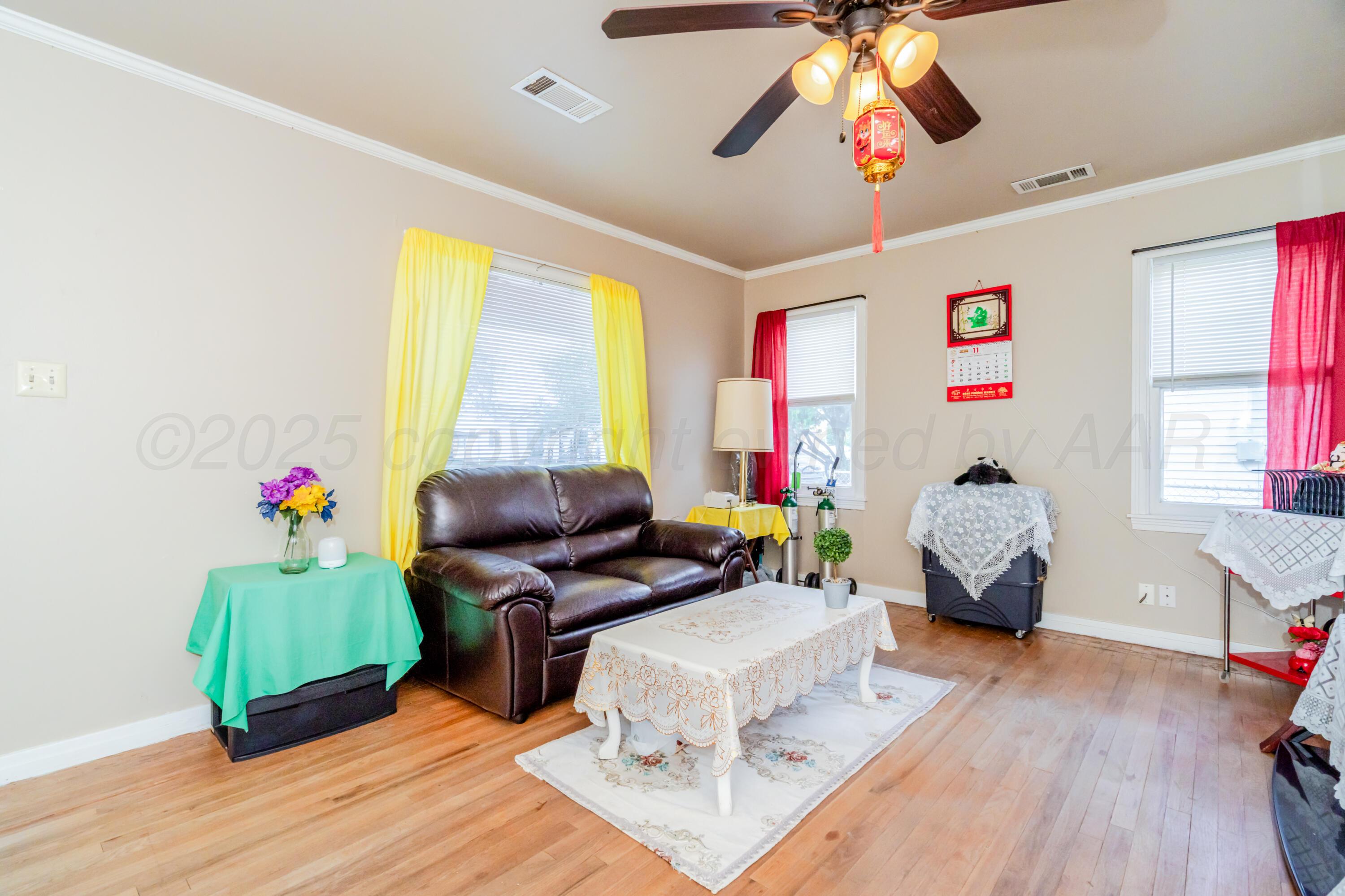 4205 South Jackson Street Amarillo, TX 79110 - Photo 7 of 22 a living room with furniture and a wooden floor