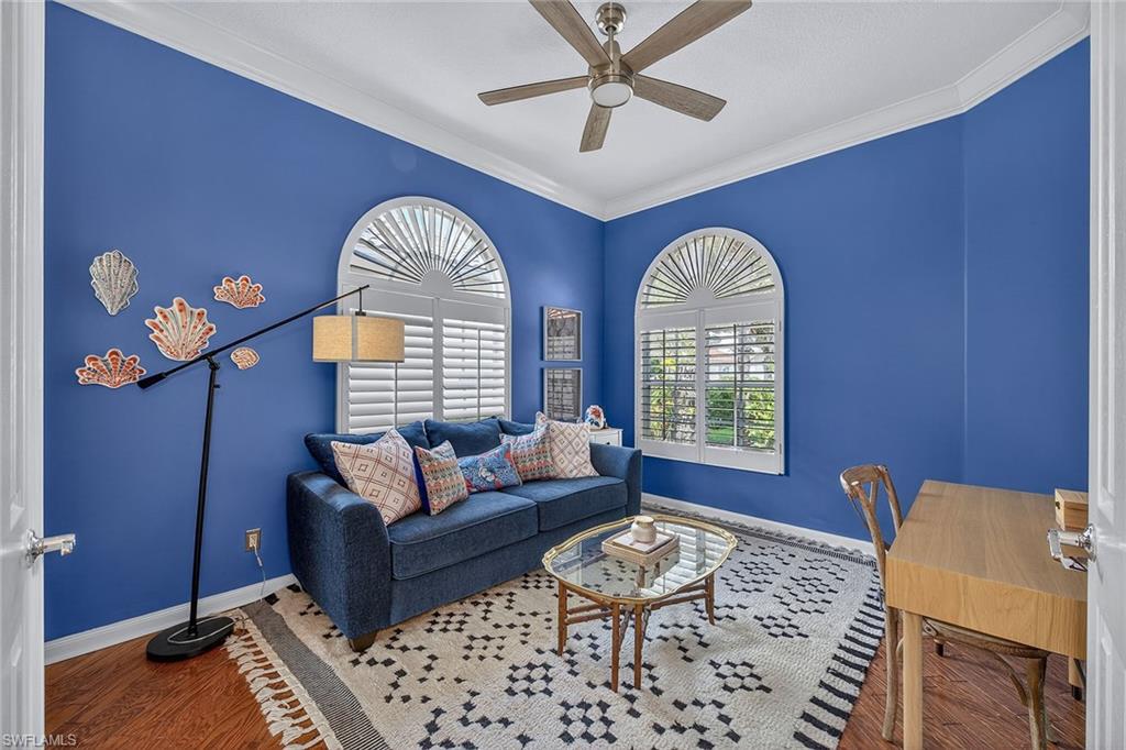 4013 Trinidad Way Naples, FL 34119 - Photo 21 of 35 a living room with furniture and a large window