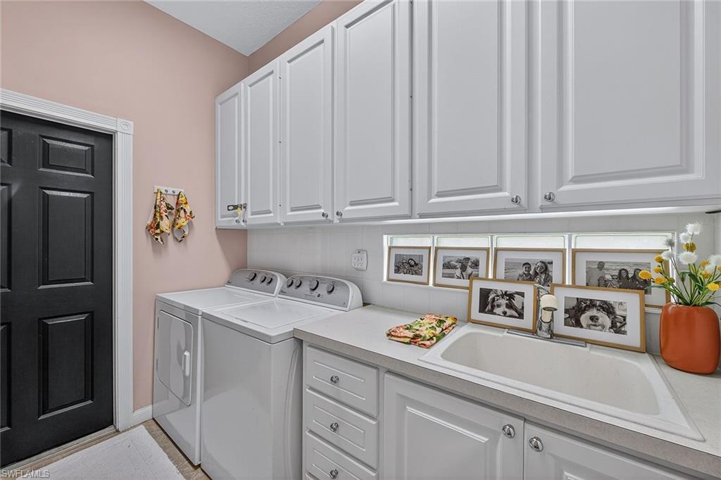 4013 Trinidad Way Naples, FL 34119 - Photo 23 of 35 a room with storage and utility