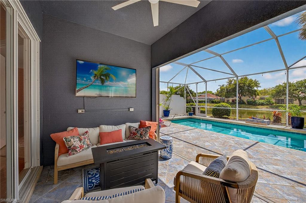 4013 Trinidad Way Naples, FL 34119 - Photo 24 of 35 a outdoor living space with furniture and garden view
