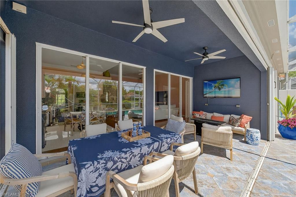 4013 Trinidad Way Naples, FL 34119 - Photo 25 of 35 a living room with furniture and a large window