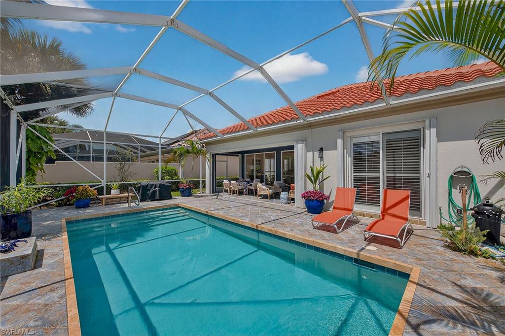 4013 Trinidad Way Naples, FL 34119 - Photo 28 of 35 a view of a backyard with sitting area