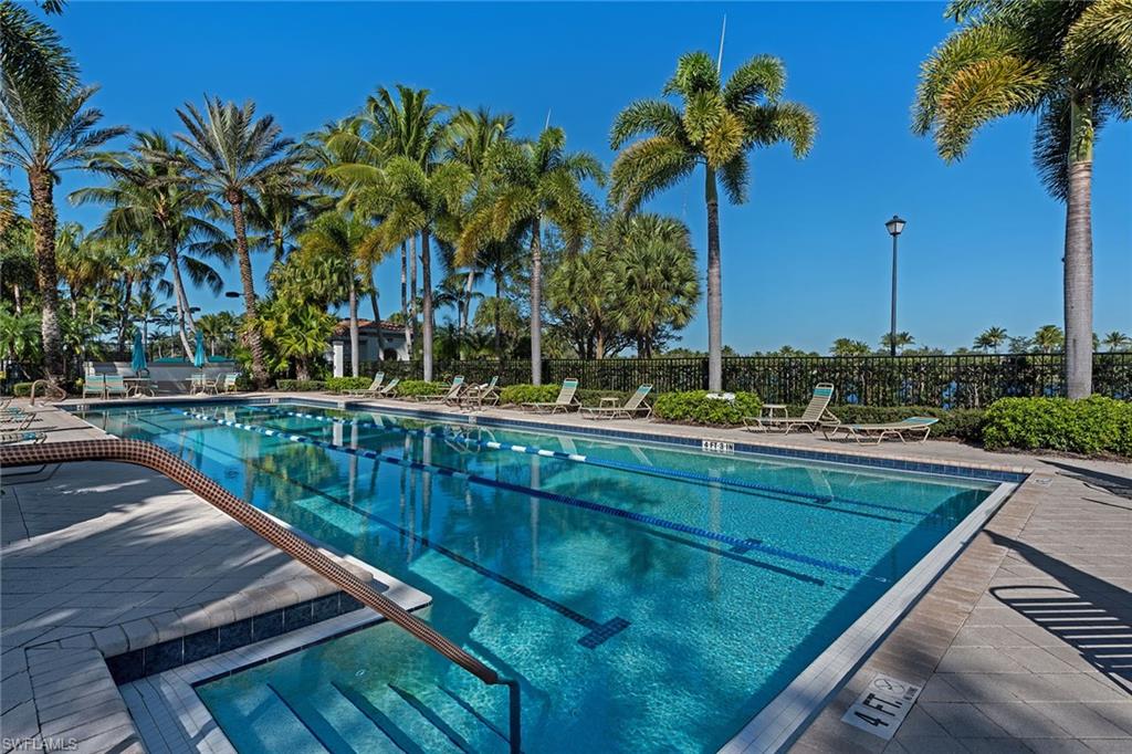 4013 Trinidad Way Naples, FL 34119 - Photo 31 of 35 a view of swimming pool with chairs