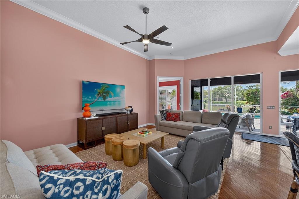 4013 Trinidad Way Naples, FL 34119 - Photo 4 of 35 a living room with furniture and a large window