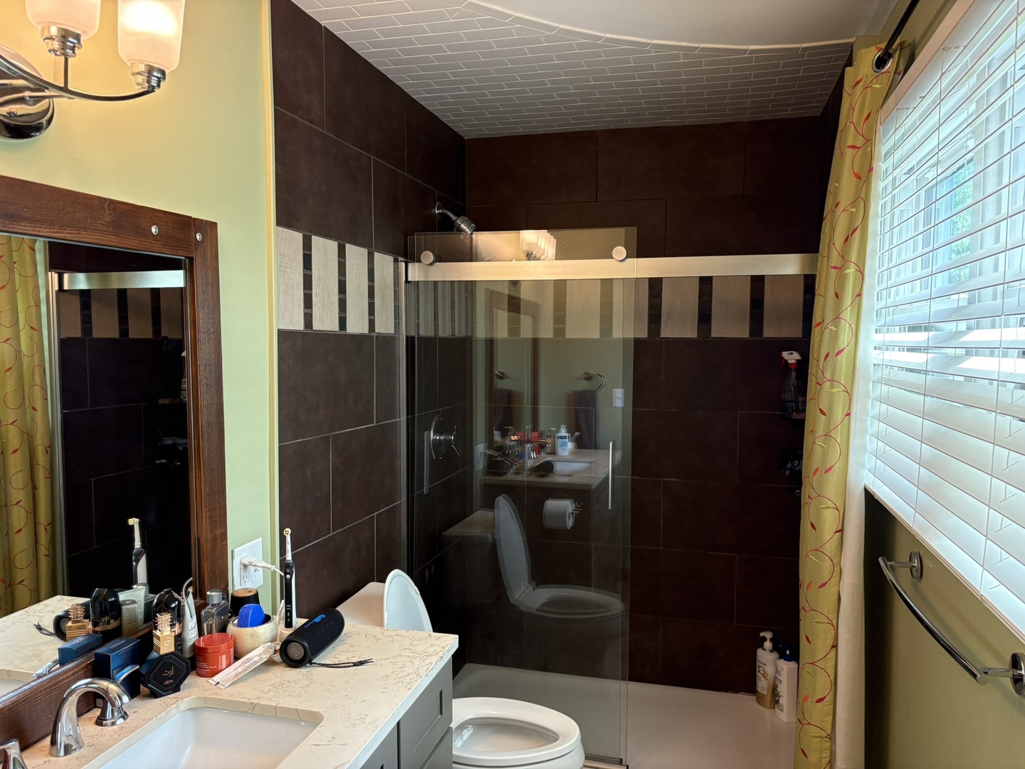 609 West Gartner Road Naperville, IL 60540 - Photo 18 of 23 a bathroom with a sink a toilet and shower
