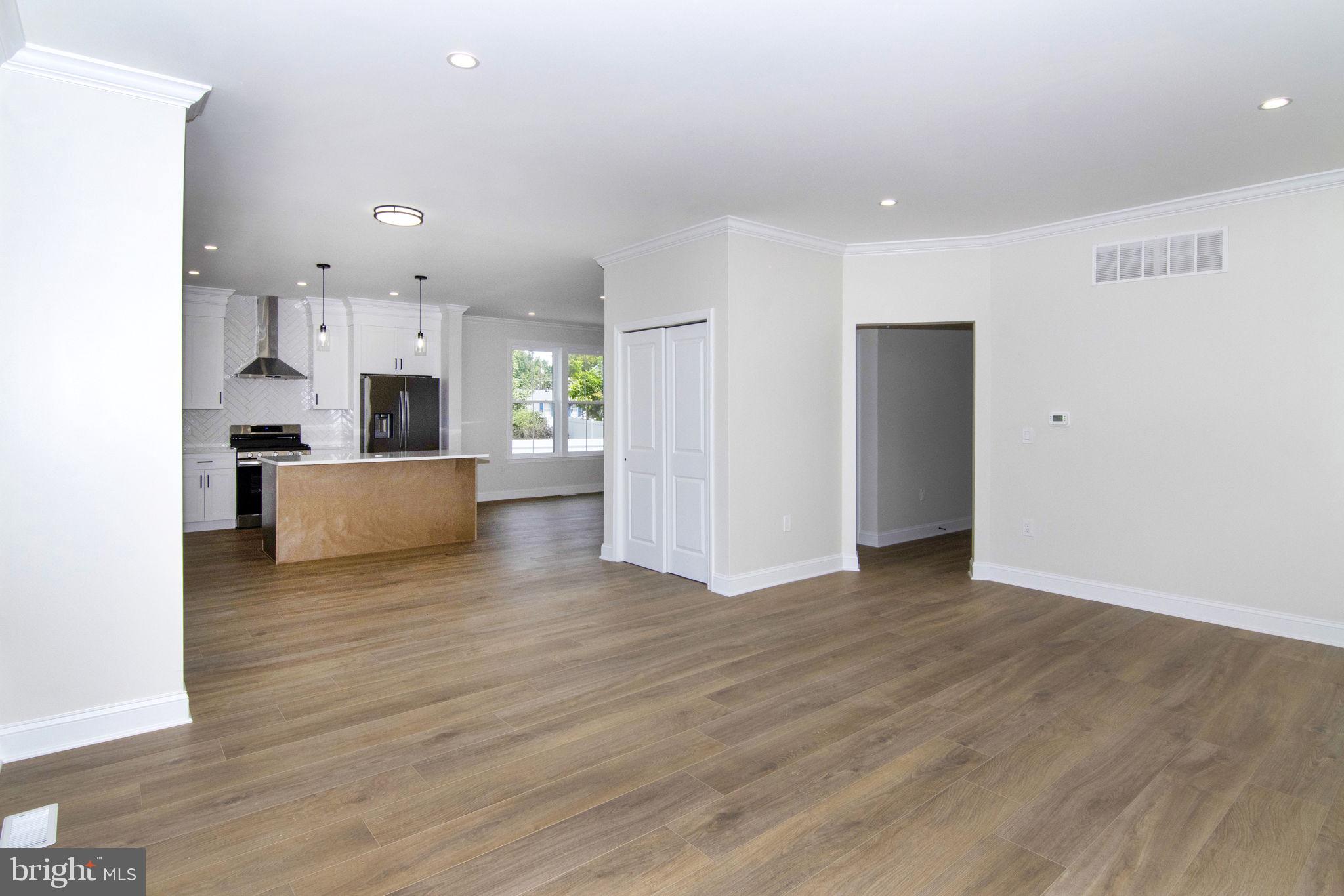903 Mercer Street Cherry Hill, NJ 08002 - Photo 19 of 58 a view of a kitchen with a sink and a refrigerator