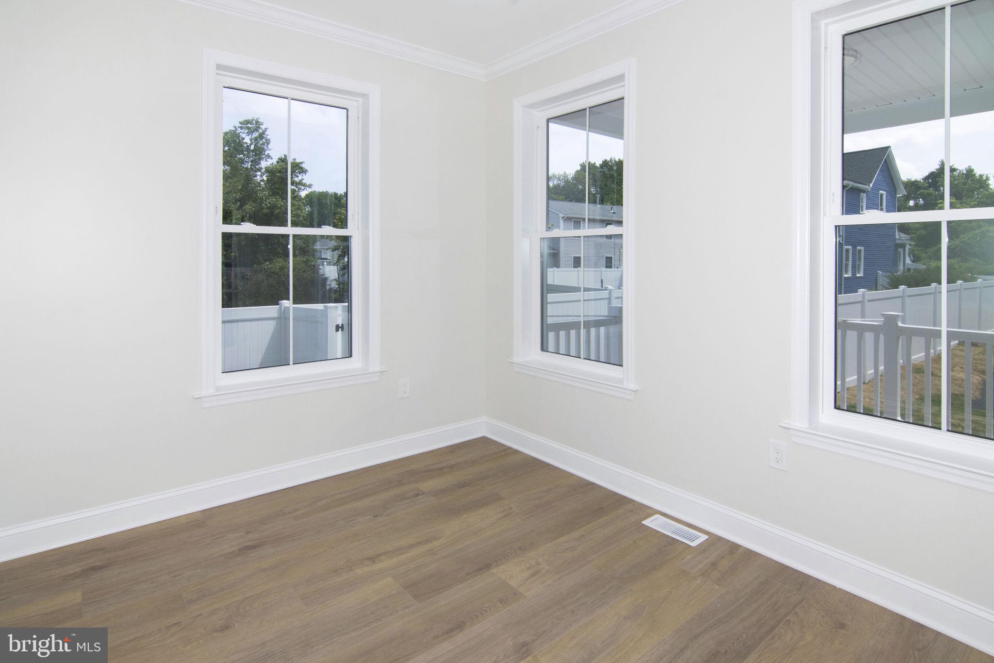 903 Mercer Street Cherry Hill, NJ 08002 - Photo 20 of 58 an empty room with wooden floor and windows