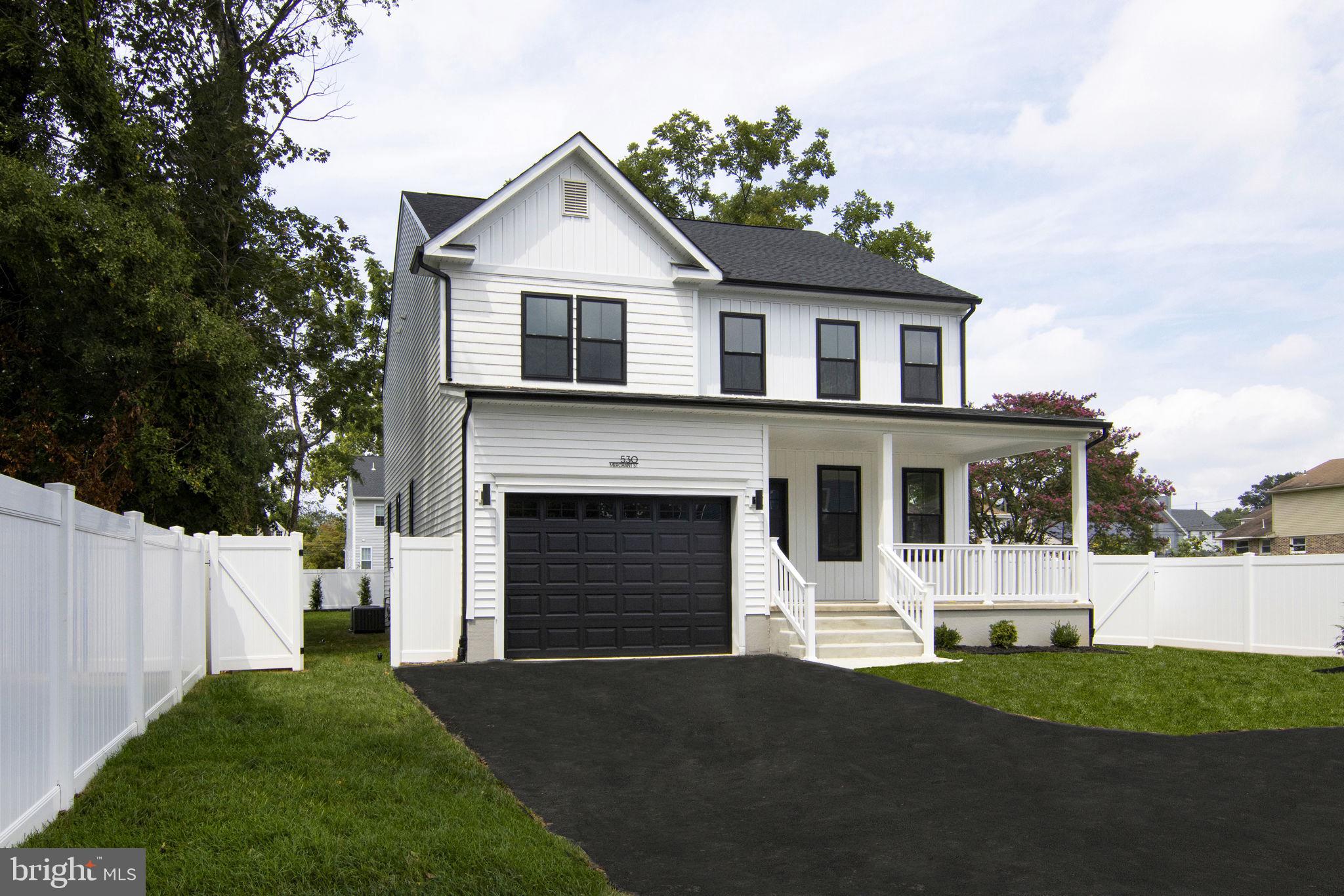 903 Mercer Street Cherry Hill, NJ 08002 - Photo 2 of 58 a front view of a house with a yard and garage