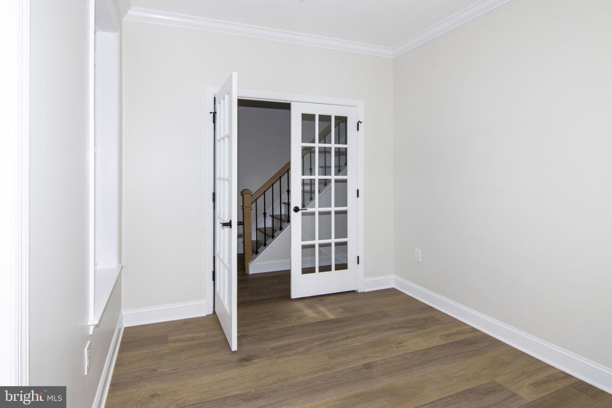 903 Mercer Street Cherry Hill, NJ 08002 - Photo 21 of 58 a view of an empty room with wooden floor and a window