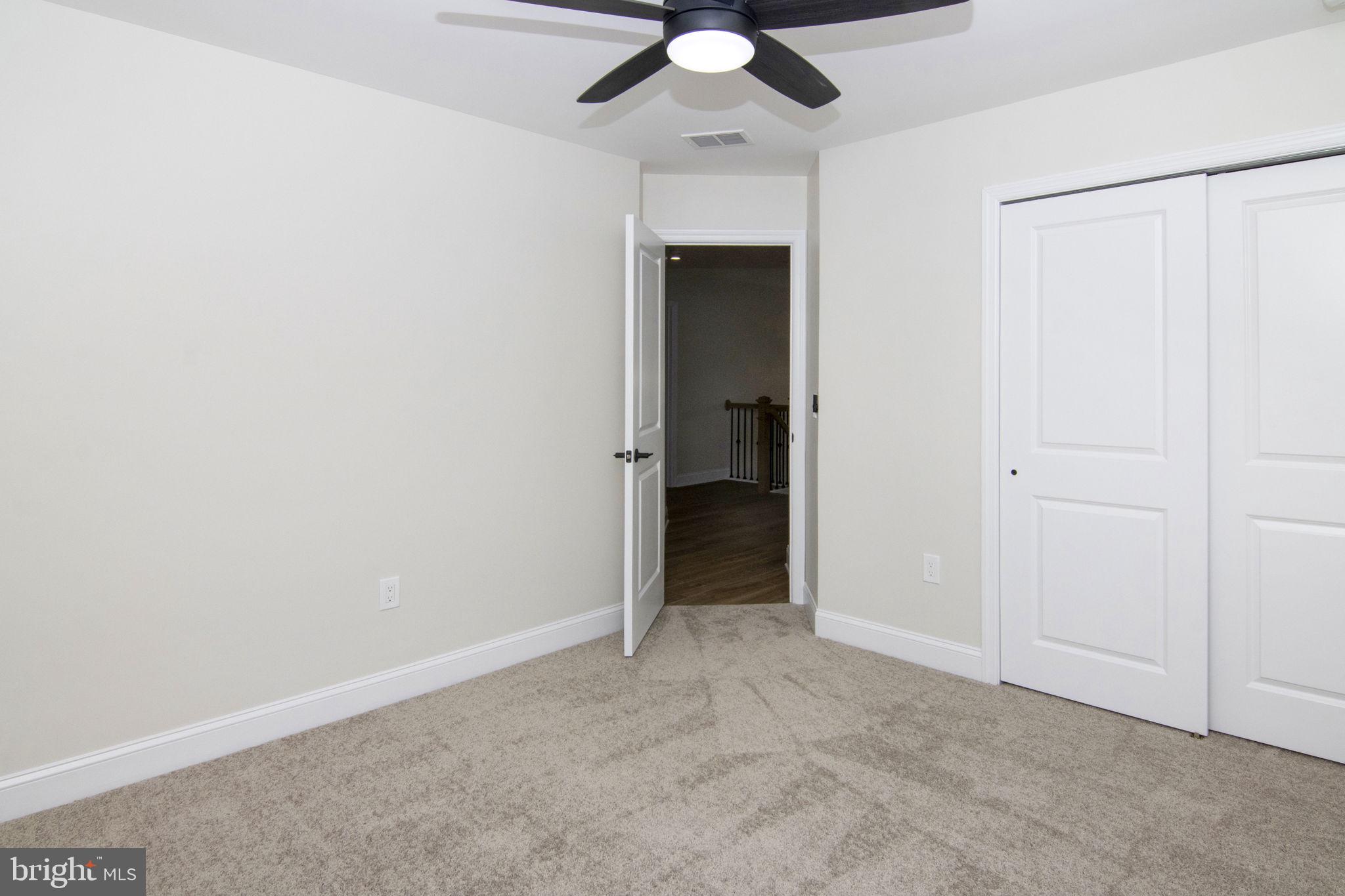 903 Mercer Street Cherry Hill, NJ 08002 - Photo 35 of 58 an empty room with a ceiling fan and a window