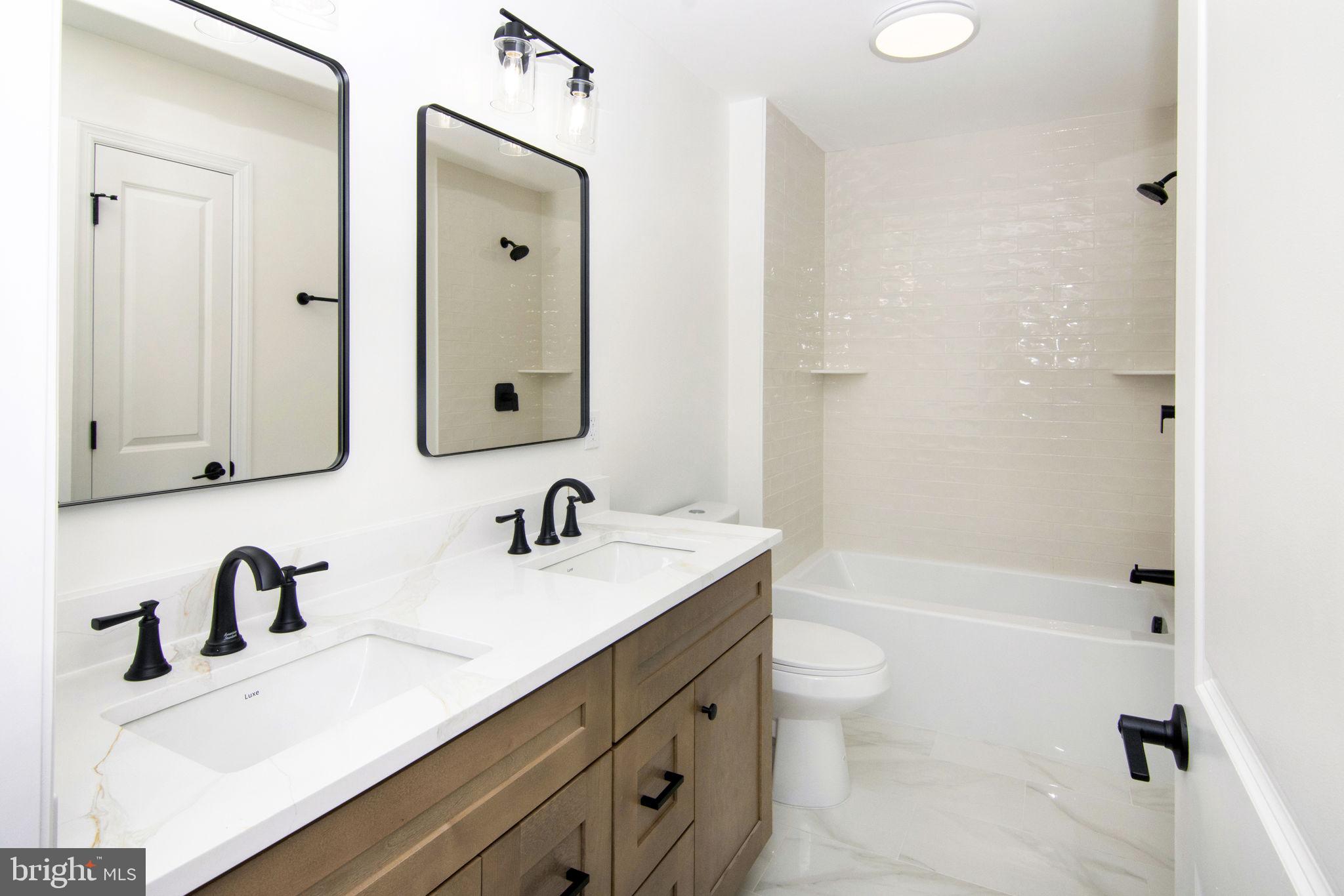 903 Mercer Street Cherry Hill, NJ 08002 - Photo 36 of 58 a bathroom with a sink a toilet and shower