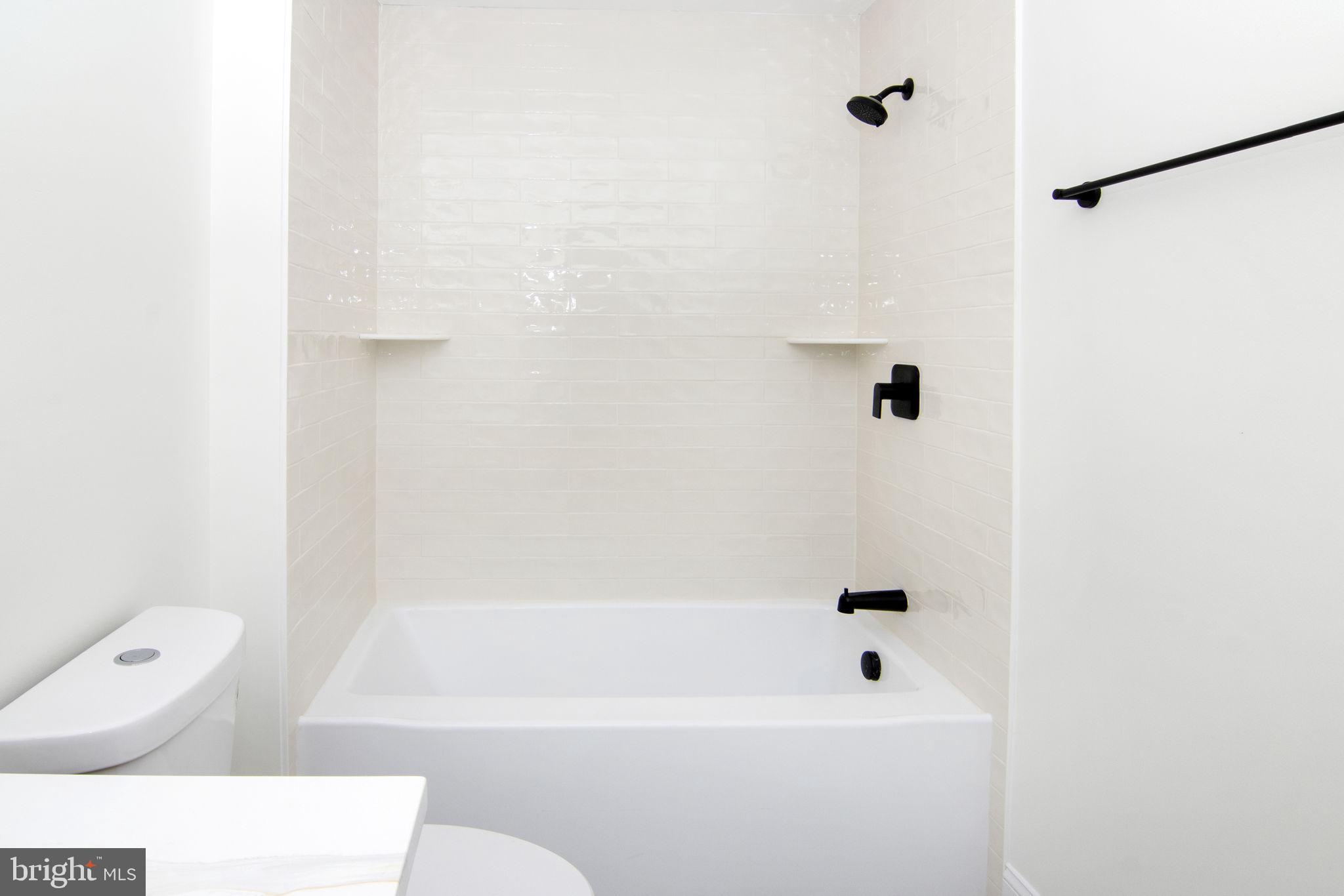 903 Mercer Street Cherry Hill, NJ 08002 - Photo 37 of 58 a bathroom with a bathtub and a shower