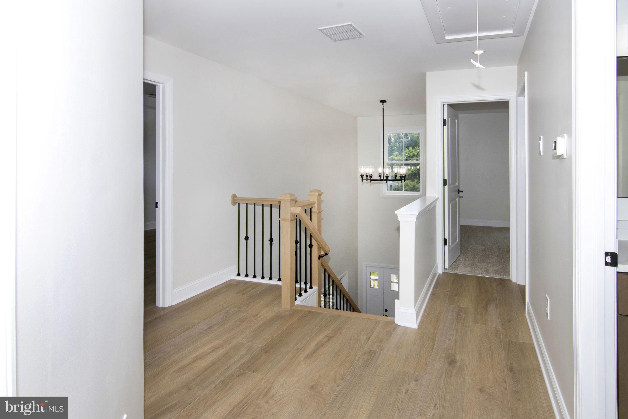 903 Mercer Street Cherry Hill, NJ 08002 - Photo 44 of 58 a view of a hallway with wooden floor and entryway