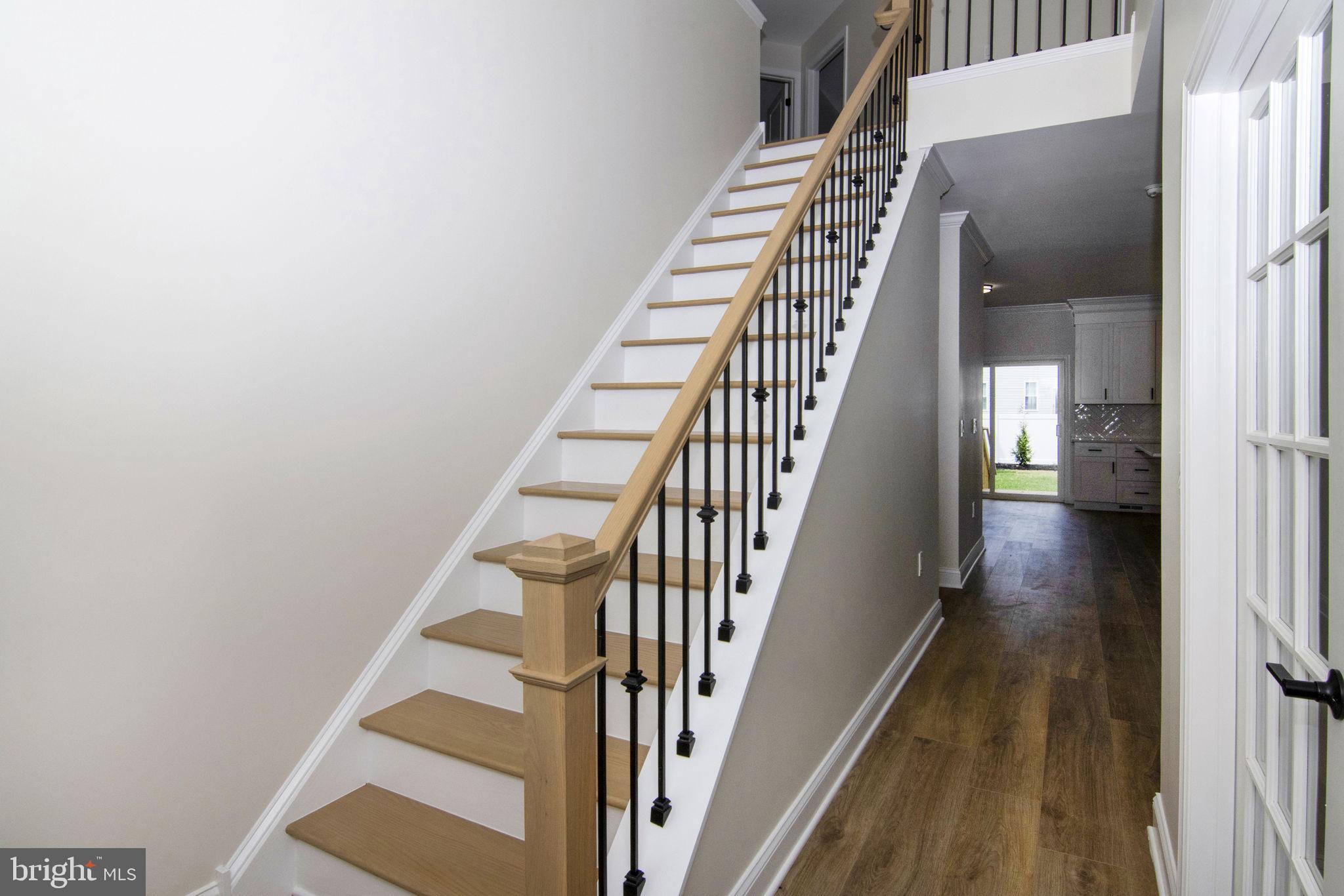 903 Mercer Street Cherry Hill, NJ 08002 - Photo 6 of 58 a view of staircase with wooden floor and white walls