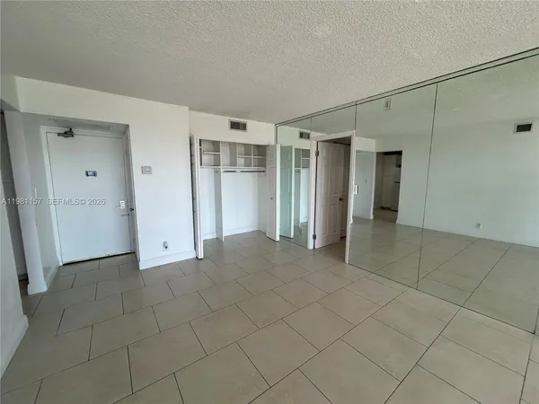 a bathroom with a toilet and a bath tub