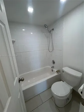 a view of a door and wooden floor