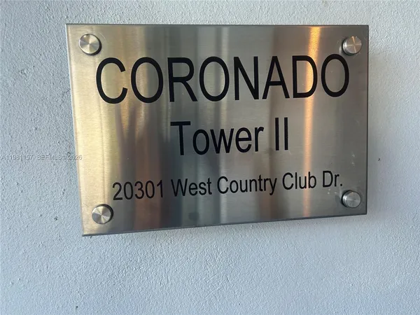 a view of a hallway and a kitchen