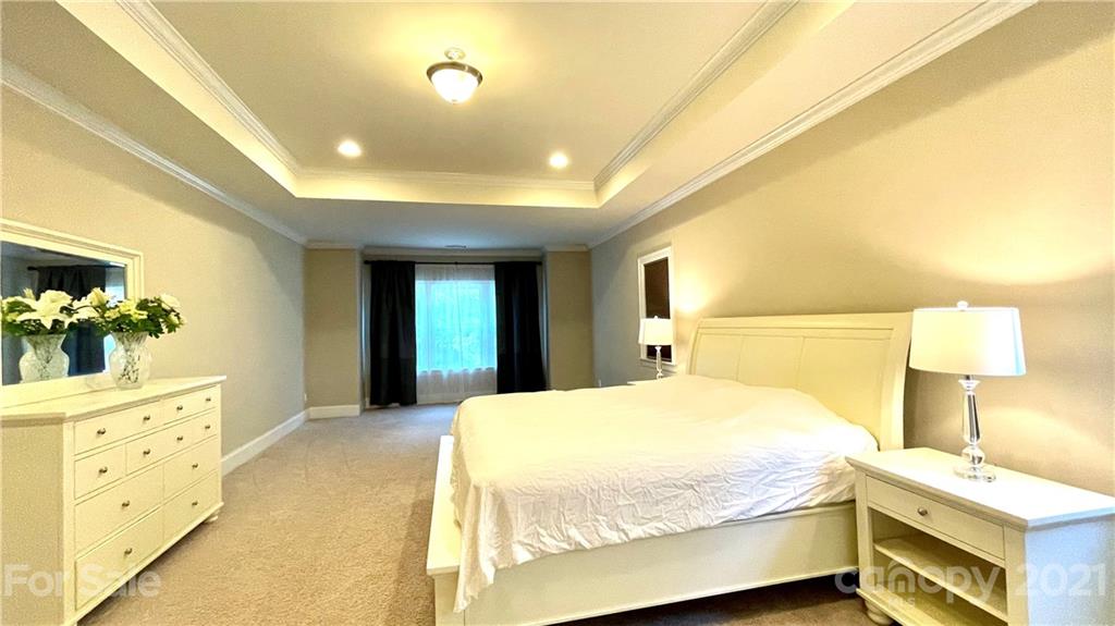 1538 Afton Way Fort Mill, SC 29708 - Photo 22 of 47 a bedroom with a bed and a dresser with mirror